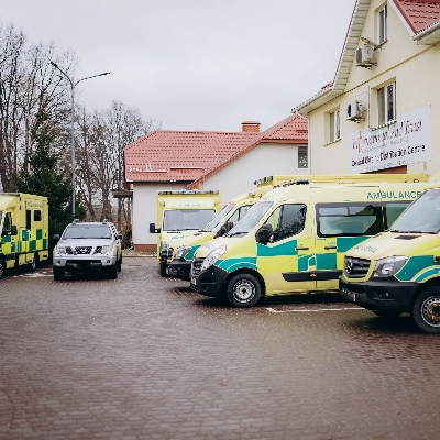 Ambulances and pickup truck at distribution centre